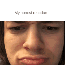 a close up of a man 's face with the words " my honest reaction " above it