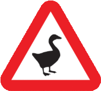 a red and white triangle sign with a black duck on it