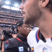 a man wearing a jersey with the letter c on the sleeve