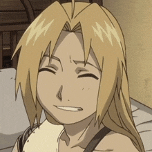 a close up of edward elric from full metal alchemist making a funny face .