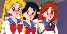 three anime girls are standing next to each other with one holding a cat