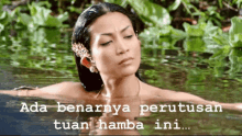 a woman is swimming in a body of water with the words ada benarnya perutusan tuan hamba ini written on the bottom