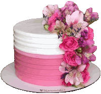 a pink and white cake decorated with pink roses and pink flowers