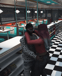 a man and woman are hugging in a diner with a checkerboard floor