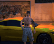 a shirtless man is standing in front of a yellow car with the word riders on the tires