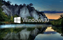 a windows 10 wallpaper with a lake and mountains