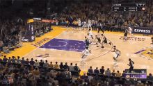 a lakers basketball game is being played in front of a crowd of people