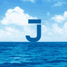 a blue letter j is floating in the ocean