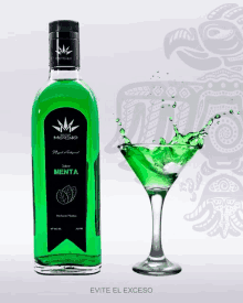 a bottle of menta next to a martini glass with a green liquid splashing out of it