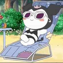 a cartoon character is sitting in a beach chair with sunglasses on .