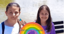 two girls standing next to each other with a rainbow in the foreground that says problem limash