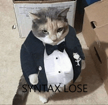 a cat wearing a tuxedo and bow tie is standing in front of boxes .