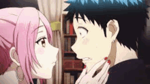 a man and a woman are kissing in a room in a anime .