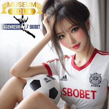 a woman holding a soccer ball with the word sbobet on her jersey