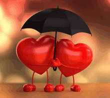 a couple of red hearts holding an umbrella