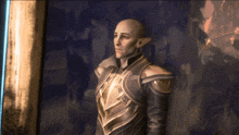 a bald man in armor stands in front of a blue background