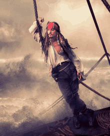 a man in a pirate costume is hanging from a rope in the air