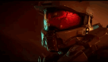 a close up of a video game character 's helmet with red lights coming out of it .