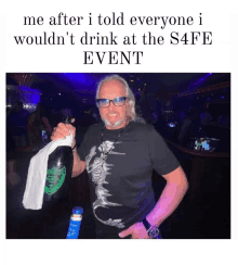 a man is holding a bottle of champagne and a napkin in a club