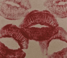 a close up of a person 's lips with red lipstick on them