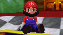 mario is sitting on the floor in a video game