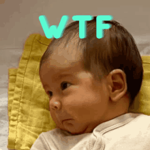 a baby with the word wtf written on its head