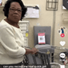 a woman is pushing a cart in a store .