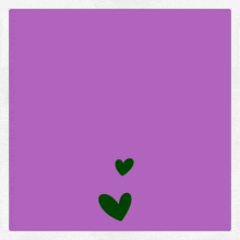 a purple background with arabic writing and two green hearts on it