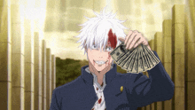 a man with blood on his face is holding a bunch of money in his hand