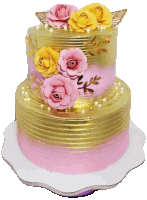 a pink and gold cake with flowers and pearls on top