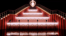 a staircase with a heart shaped light on top of it