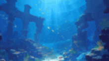 a blurred image of a coral reef with a cross in the water