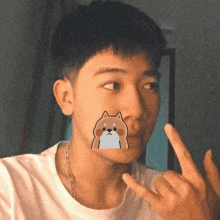 a man with a sticker of a dog on his face is giving the middle finger