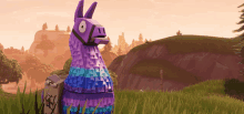 a purple and blue llama standing in a field