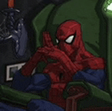 a cartoon of spider-man sitting in a chair with his hands on his face .