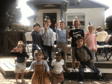 a group of children are posing for a picture including one wearing a nike shirt