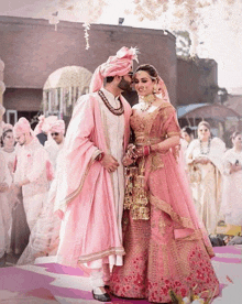 a bride and groom are posing for a picture at their wedding ceremony .