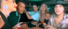 a group of people sitting in a limousine drinking