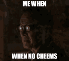 a man with glasses says me when when no cheems in a dark room