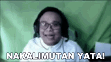 a man wearing glasses and headphones is talking on a video call and says nakalimutan yata !