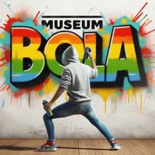 a man is spray painting the word museum bola on a wall