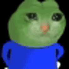 a green cat is wearing a blue shirt and has a sad look on his face .