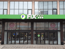 the front of a fix price store with stairs leading to it