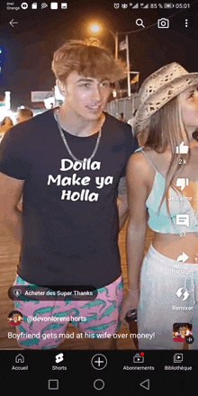 a man wearing a dolla make ya holla shirt