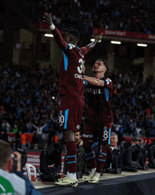 two soccer players with one wearing a number 30