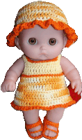 a baby doll wearing a crocheted dress and orange hat