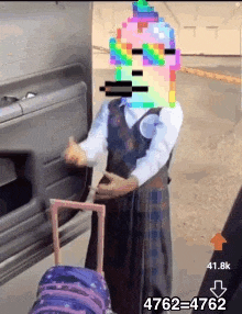 a girl with a pixelated face is standing next to a suitcase in front of a car .