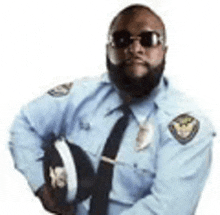 a police officer with a beard is holding a helmet .