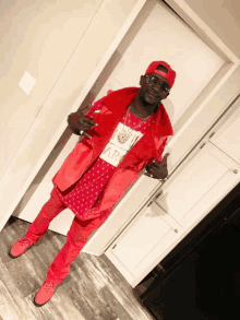 a man wearing a red vest and a shirt that says army