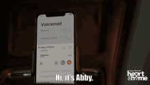 a phone displays a voicemail from abby o'brien and says hi it 's abby